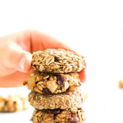 Child Grabbing Banana Oatmeal Cookie from Stack