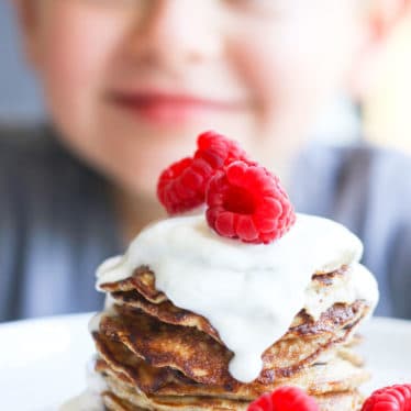 Child Looking at a Stack of Banana Pancakes