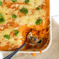 Cooked Lentil Shepherd's Pie in Dish with Spoonful Removed