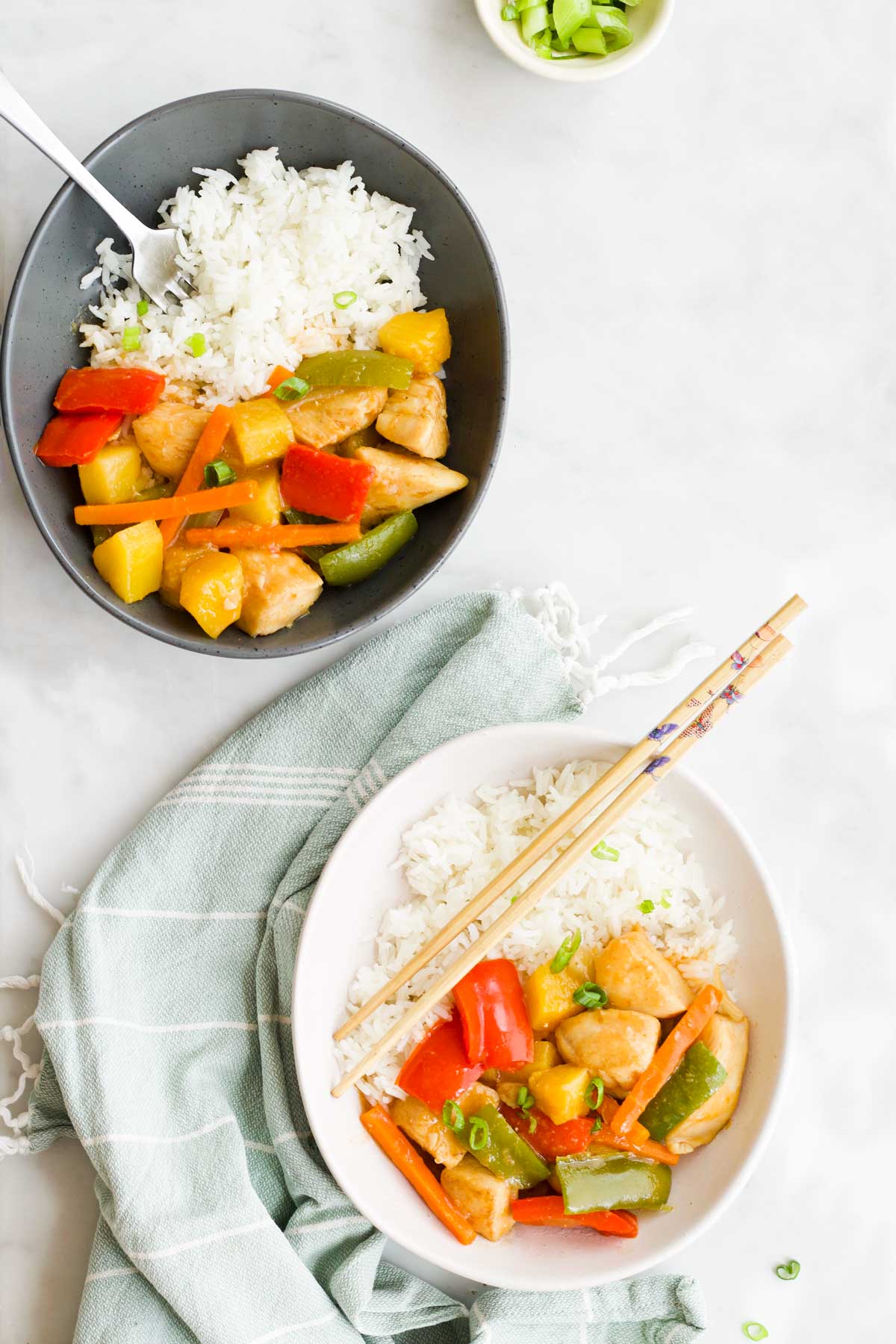 Flat Lay Shot of Two Bowls of Sweet and Sour Chicken and Rice.