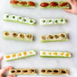 A fun way to encourage kids to eat their veggies. Celery filled with various spreads and toppings. The post sahred more ways to enjoy this fun kids snack. #kidsfood #healthysnack #funfood #healthykids