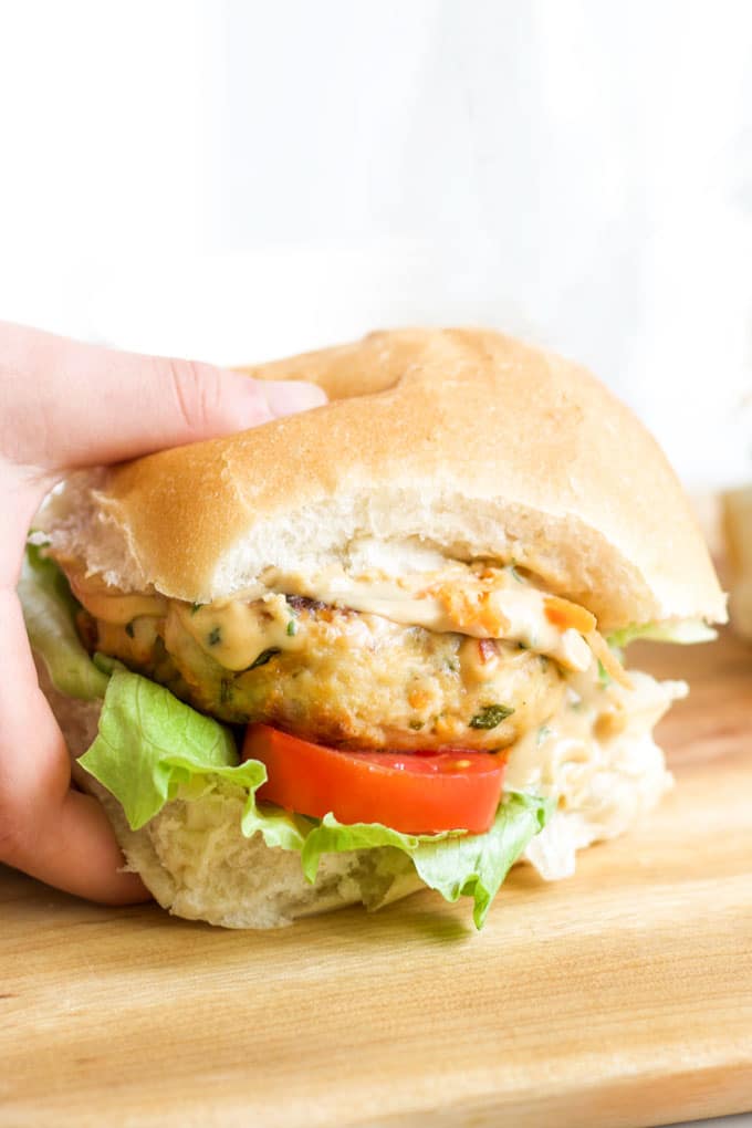 Child Grabbing Chicken Satay Burger in Bun