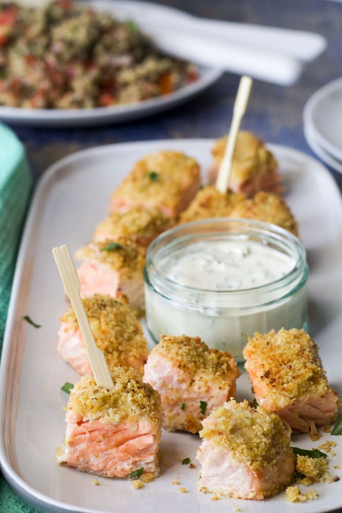 Lemon and Parmesan crusted salmon fillets cut into bite size chunks. Served with a herby creme fresh dip