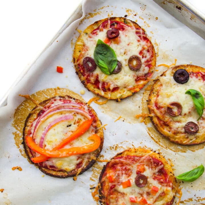 Cauliflower Base Mini Pizzas Cooked on Baking Sheet.