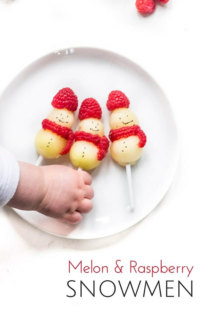 Melon Snowmen - healthy Christmas snack for kids made from melon and raspberries. Fun and festive snack.