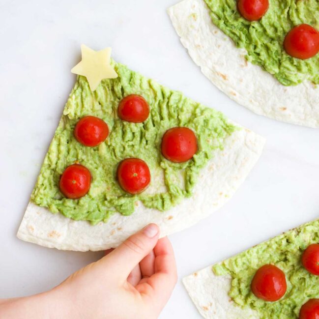 Child Grabbing an Avocado Christmas Tree