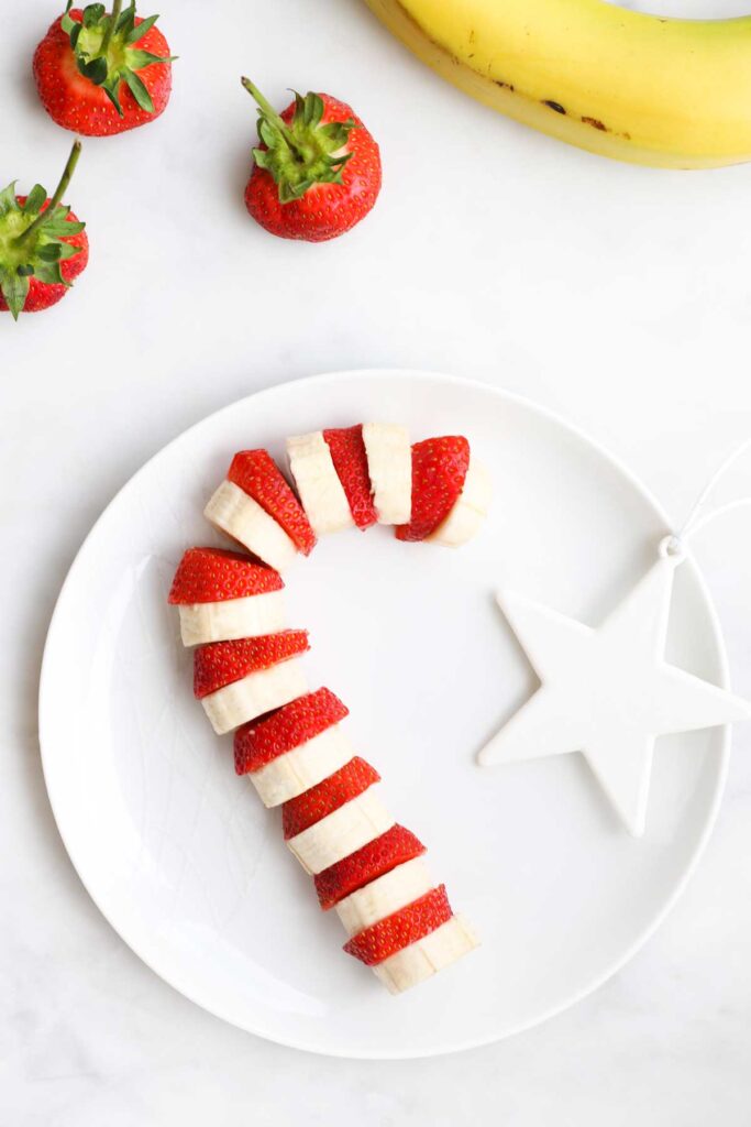 Banana and Strawberry Slices Arranged on Plate to Look Like Candy Cane