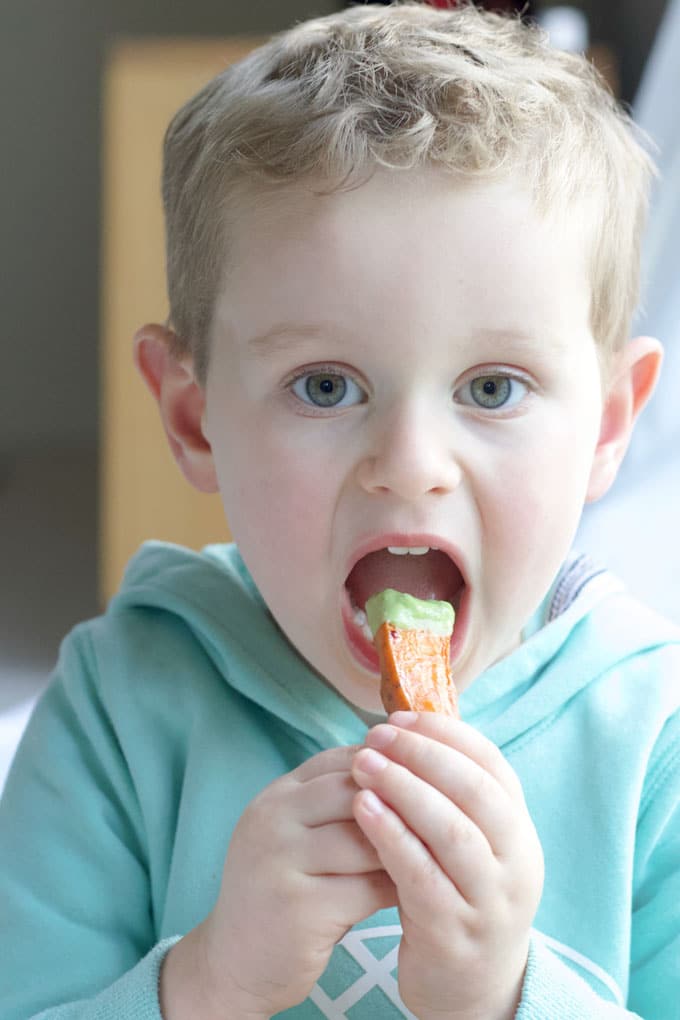 Child Eating Sweet Potato Wedges
