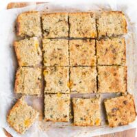 Quinoa Bars Cut into Squares on Wooden Chopping Board