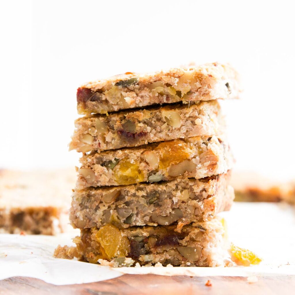 Side Shot of 5 Quinoa Bar Squares Stacked on Top of Each Other