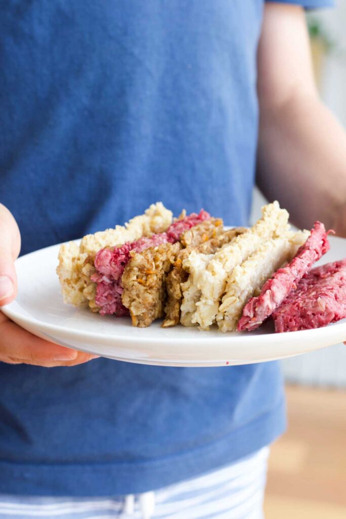 Side on Shot of Child Holding Plate of Porridge Fingers (4 Different Varieties)