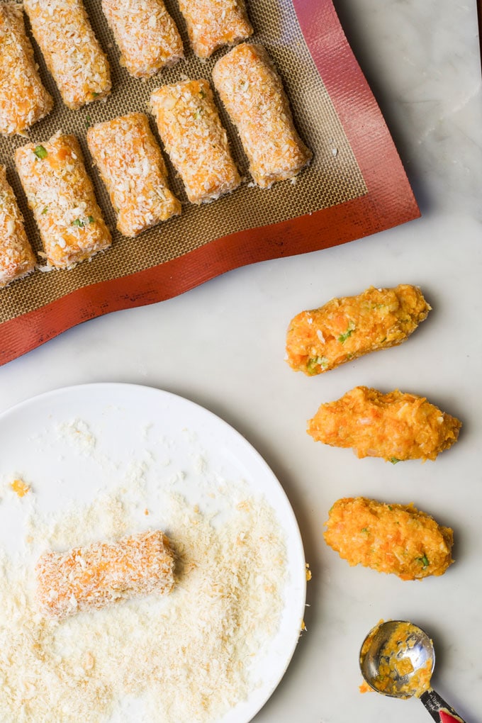 Rolling Process Shot of Rolling Croquettes in Breadcrumbs