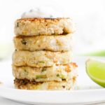Side on View of Stack of 5 Tuna Fish Cakes Topped with Yogurt Dip