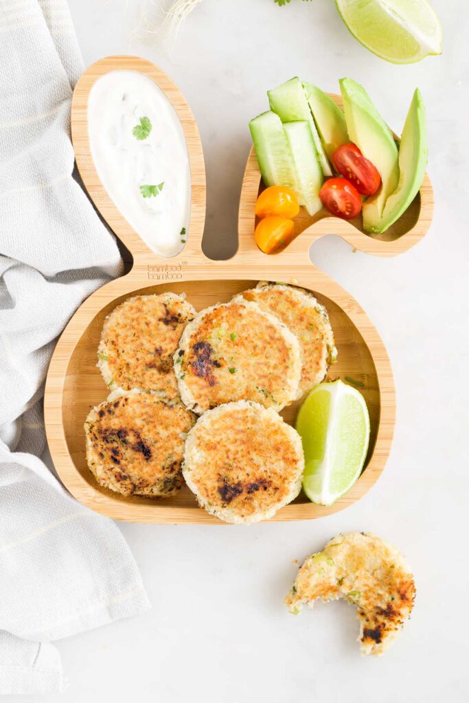 Tuna Fish Cakes on a Toddler Bunny Plate with Yogurt and Chopped Vegetables.