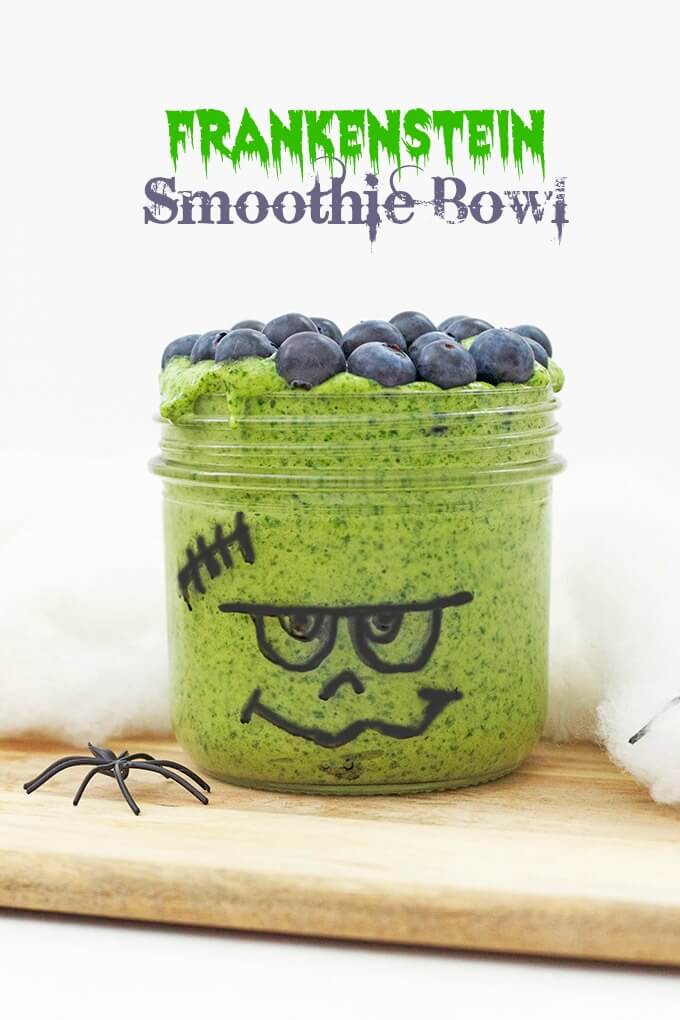 Frankenstein Smoothie Bowl (healthier halloween snacks for kids) Spinach, banana and mango blended together and topped with blueberries