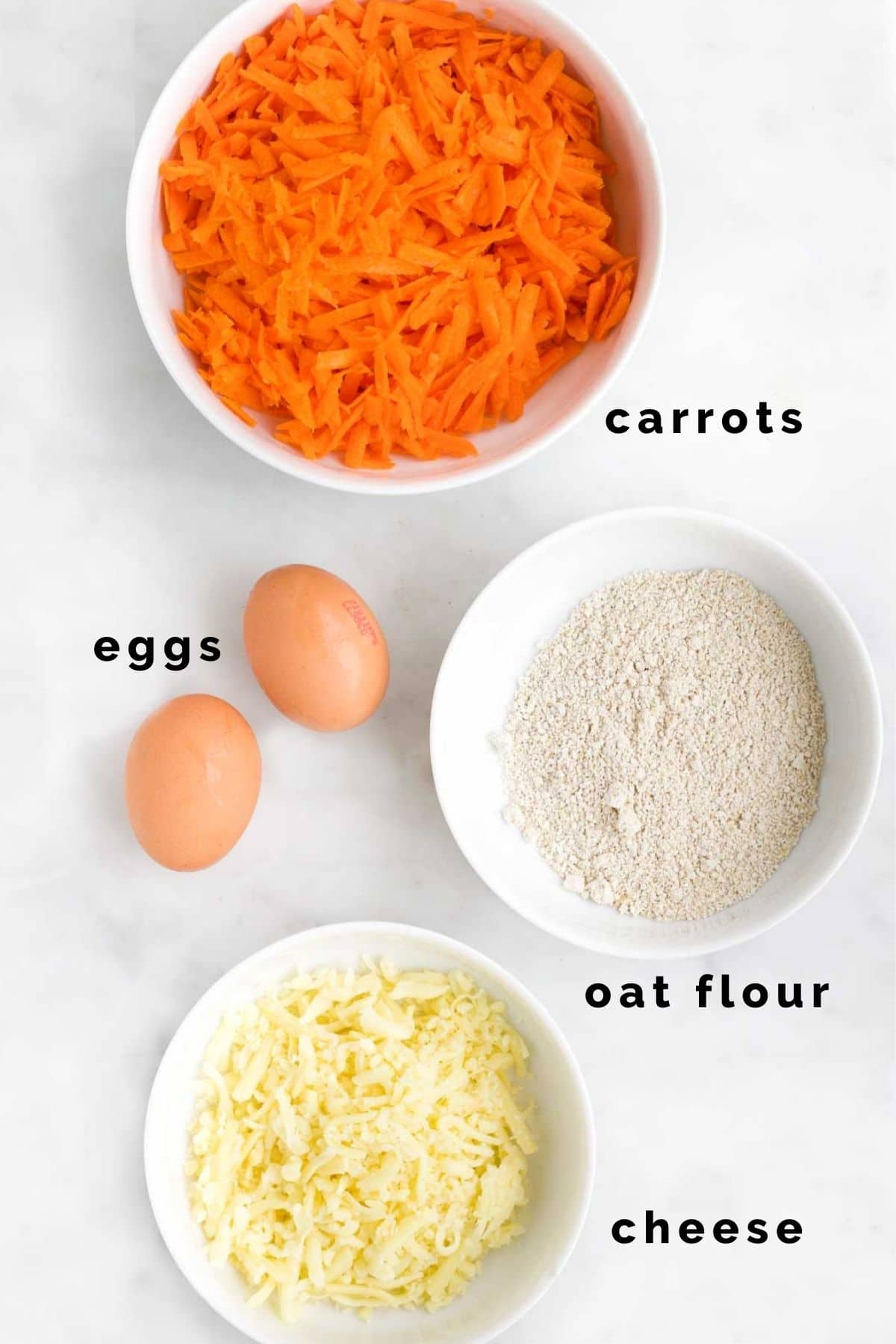 Flat Lay Shot of the Ingredients Needed to Make Carrot Stars. (Carrots, Oat flour, eggs and Cheese)