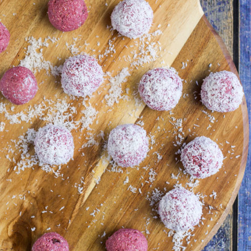 Raspberry Coconut Breakfast balls, sweetened only with fruit. A perfect hand held breakfast for young kids. No refined sugar or sweeteners.