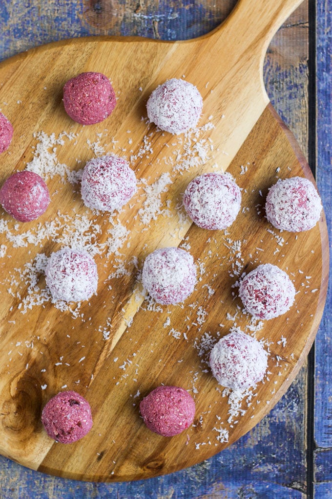 Raspberry Coconut Breakfast balls, sweetened only with fruit. A perfect hand held breakfast for young kids. No refined sugar or sweeteners. 