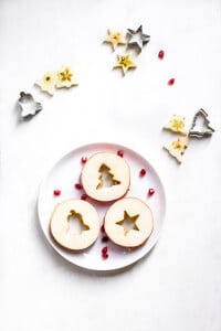 Apple and peanut butter Christmas Sandwiches made from two slices of apple filled with peanut butter.