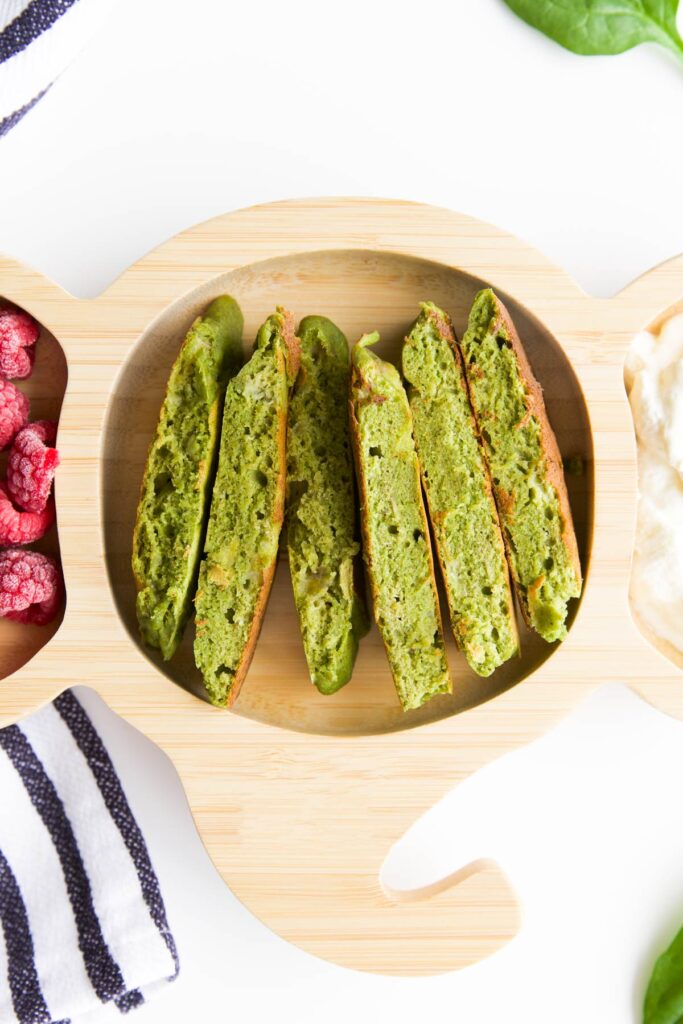 Spinach Pancakes Cut into Strips and Plated on Elephant Shaped Toddler Plate