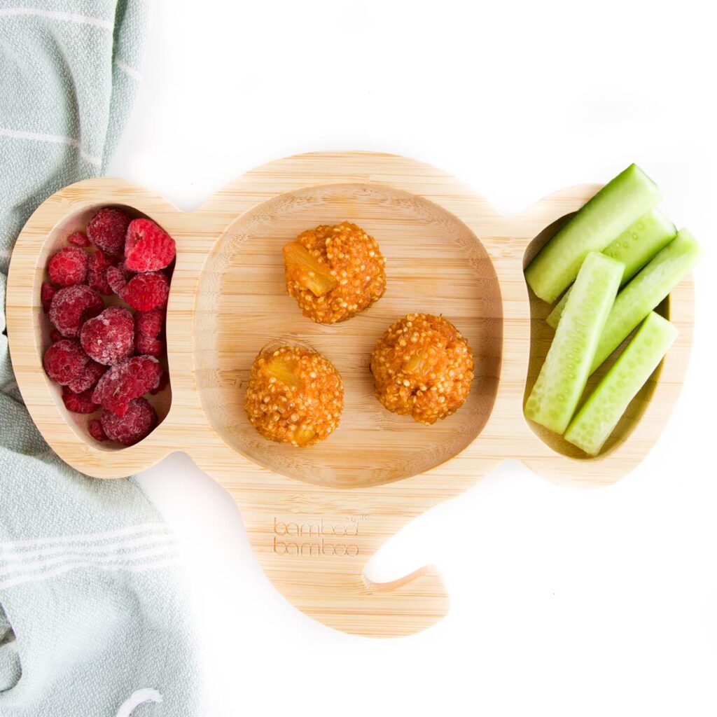 Quinoa Balls on Toddler Plate with Cucumber Fingers and Raspberries