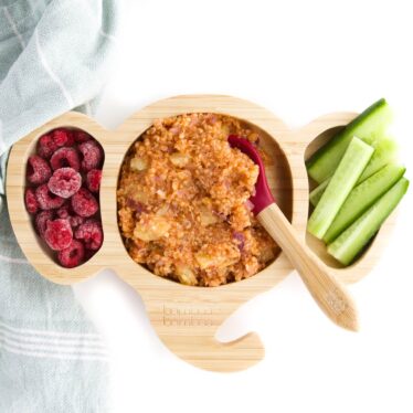 Sweet and Sour Quinoa In Toddler Plate Served with Cucumber and Raspberries