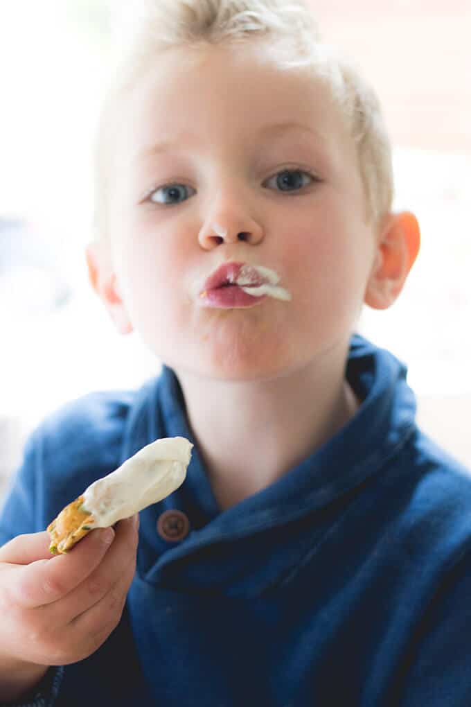 Child Eating a Lentil Pancake