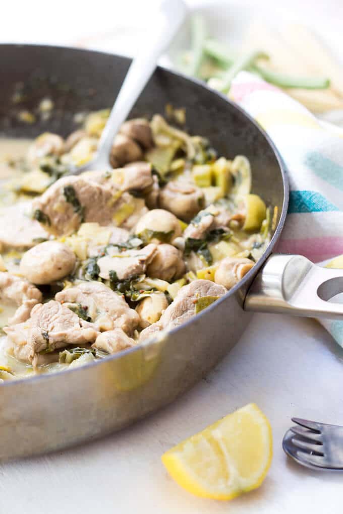 Side Shot of Pork and Creamy Apple Sauce in Pan. 