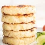 Side Shot of stack of Bubble and Squeak Cakes with Text overlay "Bubble and Squeak Cakes"