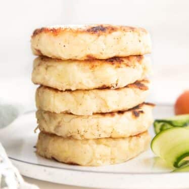 Stack of 5 Bubble and Squeak Patties on White Plate