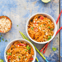 These Asian style sweet potato noodles are sure to be loved by the whole family. Sweet potato are spiralized and cooked in an asian style peanut sauce. Kid friendly