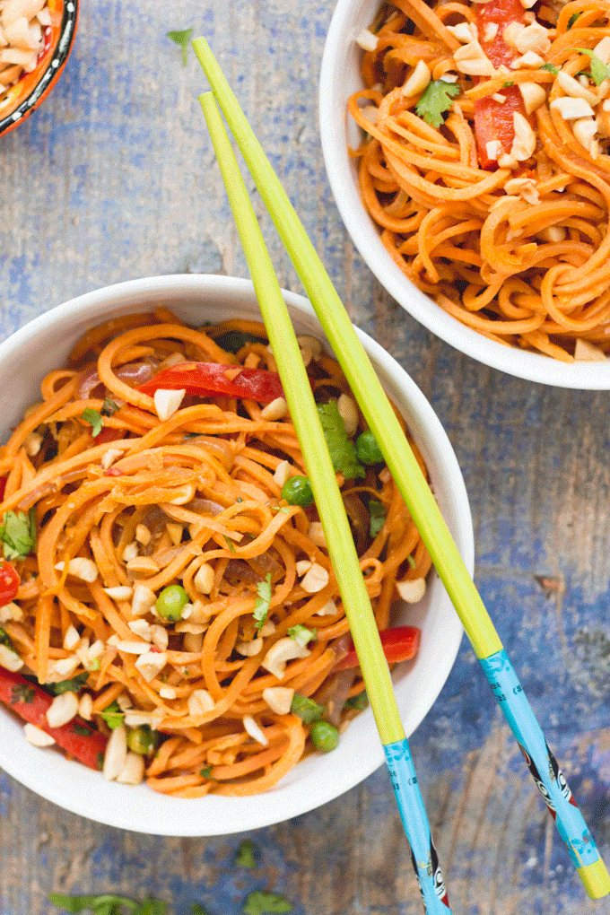 These Asian style sweet potato noodles are sure to be loved by the whole family. Sweet potato are spiralized and cooked in an asian style peanut sauce. 