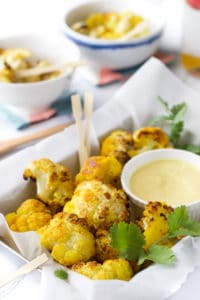 turmeric oven roasted cauliflower bites with a sweet curried mango dip. A kid friendly way to save cauliflower
