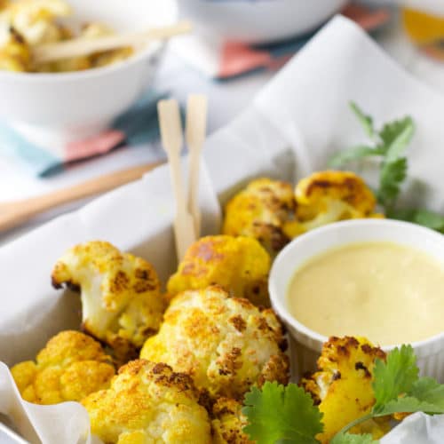 turmeric oven roasted cauliflower bites with a sweet curried mango dip. A kid friendly way to save cauliflower