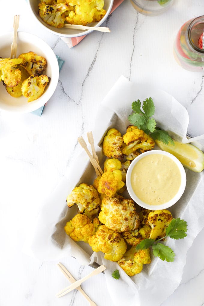 Top down view of Turmeric Roasted Cauliflower Pieces Served With Dip