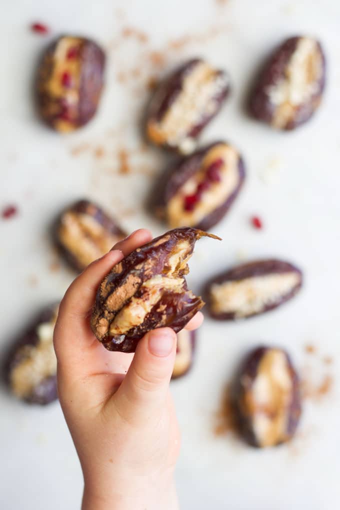 Child holding peanut butter stuffed date