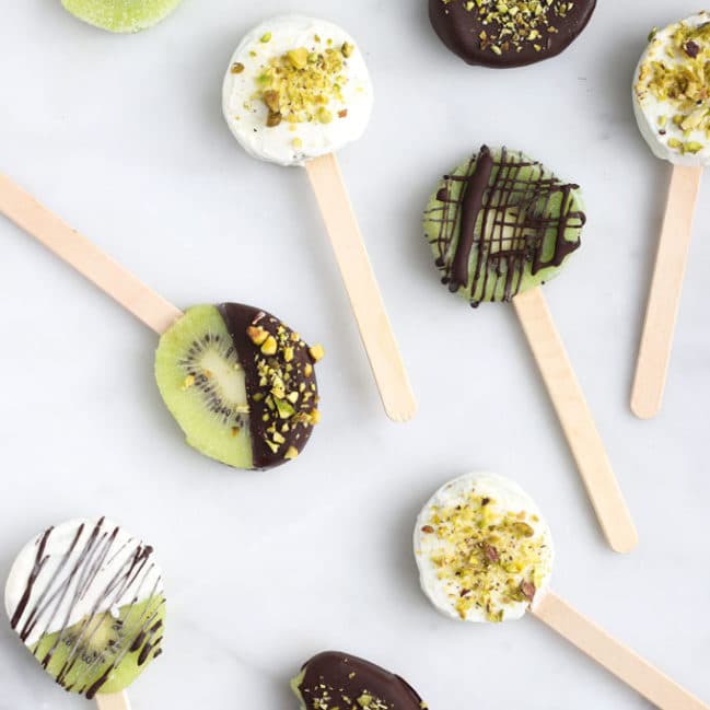 Frozen Kiwi Pops Coated in Yoghurt and Chocolate with Crushed Pistachio