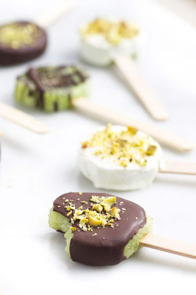 Frozen Kiwi Pops One with Bite Out of it.