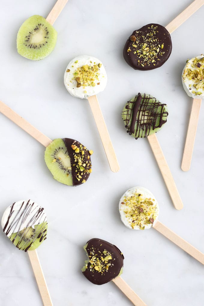 Frozen Kiwi Pops Coated in Yoghurt and Chocolate with Crushed Pistachio