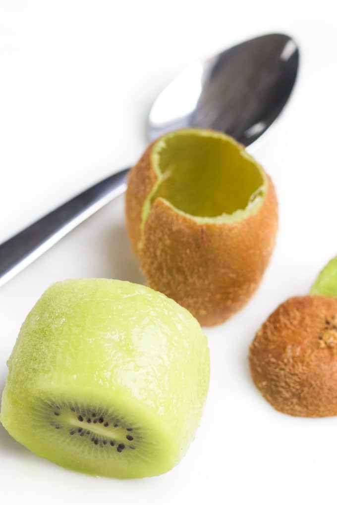 Kiwi Peeled using Spoon Method with Peel in Background