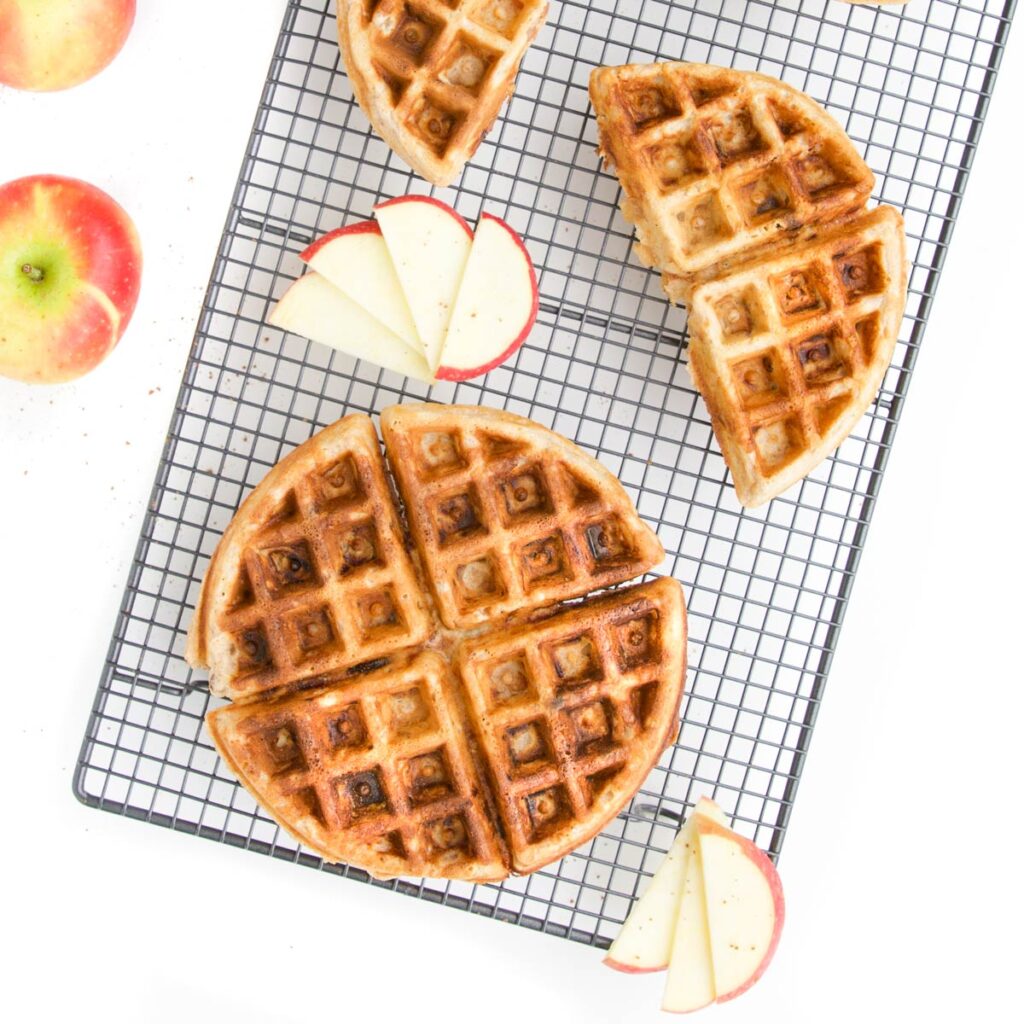 Apple Waffles on Cooling Rack with Apple Slices Scattered