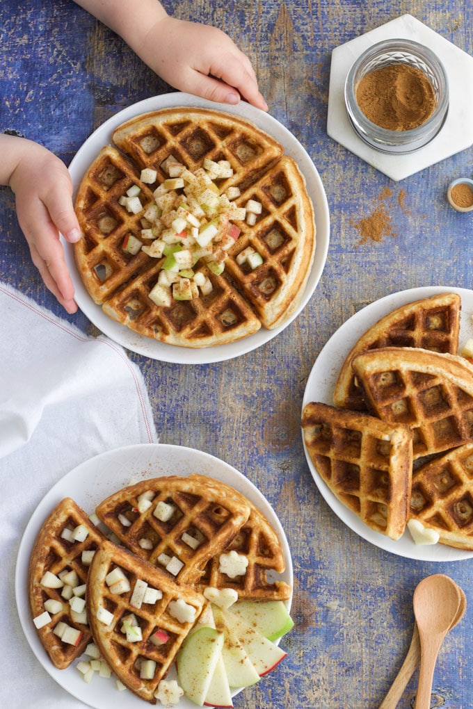 Apple Waffle Stacks Topped with Fresh Apple. Child Grabbing Plate
