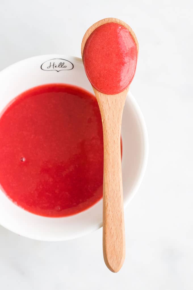 Strawberry Puree in Baby Bowl with Baby Spoon.