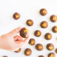 Child Holding Chocolate Orange Energy Balls