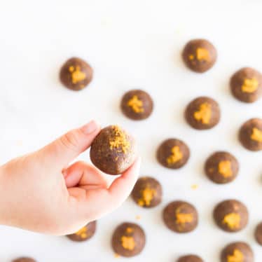 Child Holding Chocolate Orange Energy Balls