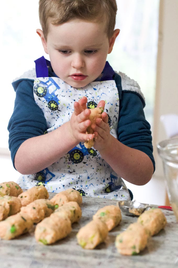 Child Rolling Salmon Croquettes