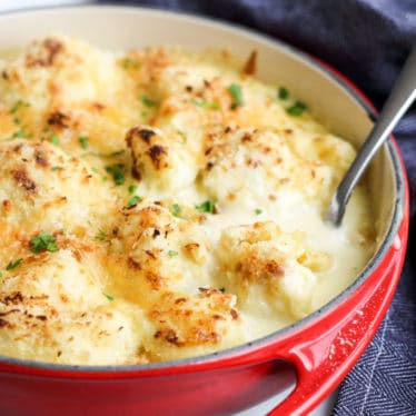 Side View of Cauliflower Cheese In Red Dish