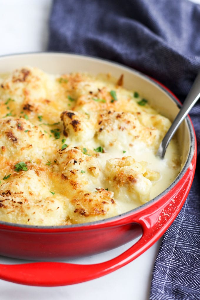 Side View of Cauliflower Cheese In Red Dish