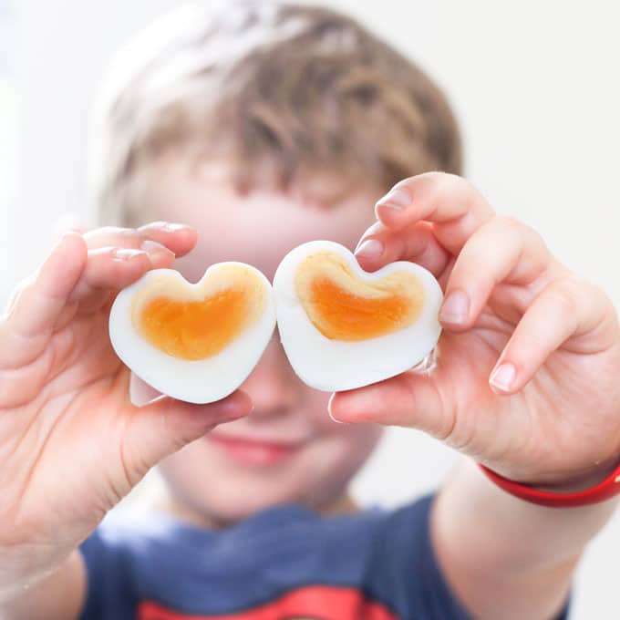 Child Holding Heart Shaped Eggs