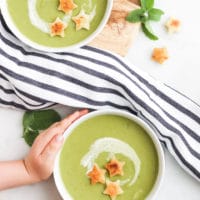 Child Grabbing Plate of Pea and Mint Soup